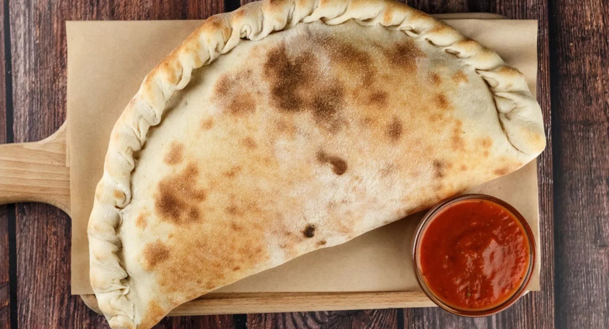 1–2 pizzy o průměru 33 cm či Calzone dle výběru a 10% sleva na nápoje
